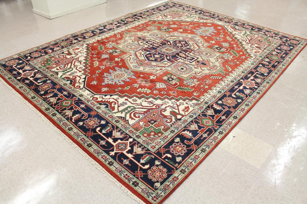 Appraisal: HAND KNOTTED ORIENTAL CARPET Persian Serapi or Heriz design centering