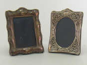 Appraisal: Two silver faced photo frames with strut backs one oval