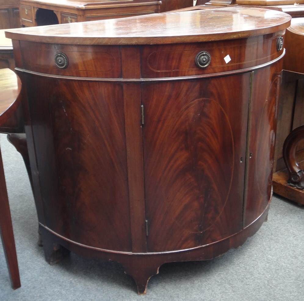 Appraisal: A th century inlaid mahogany bowfront demi-lune cabinet with three