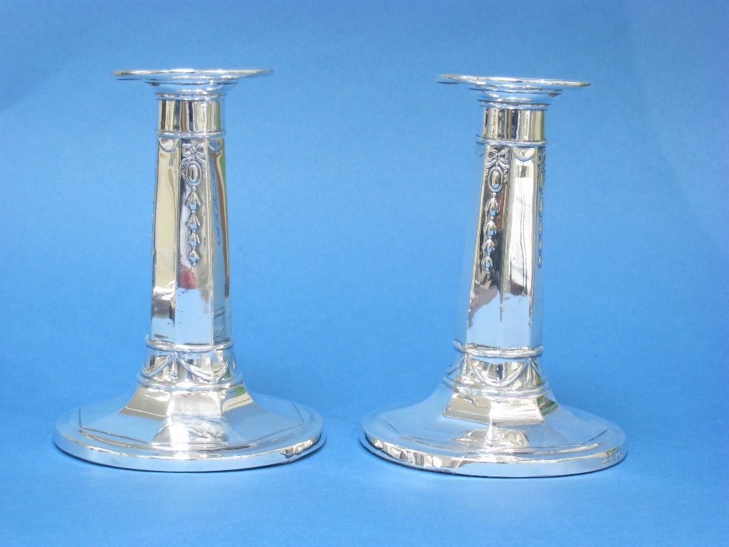 Appraisal: Pair of George V Pillar Candlesticks with ribbon and pendant