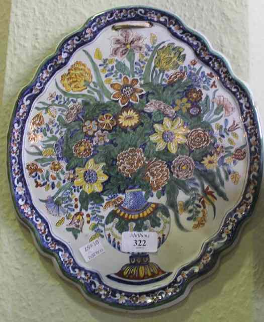 Appraisal: A DELFT WALL PLAQUE of shaped form and polychrome vase