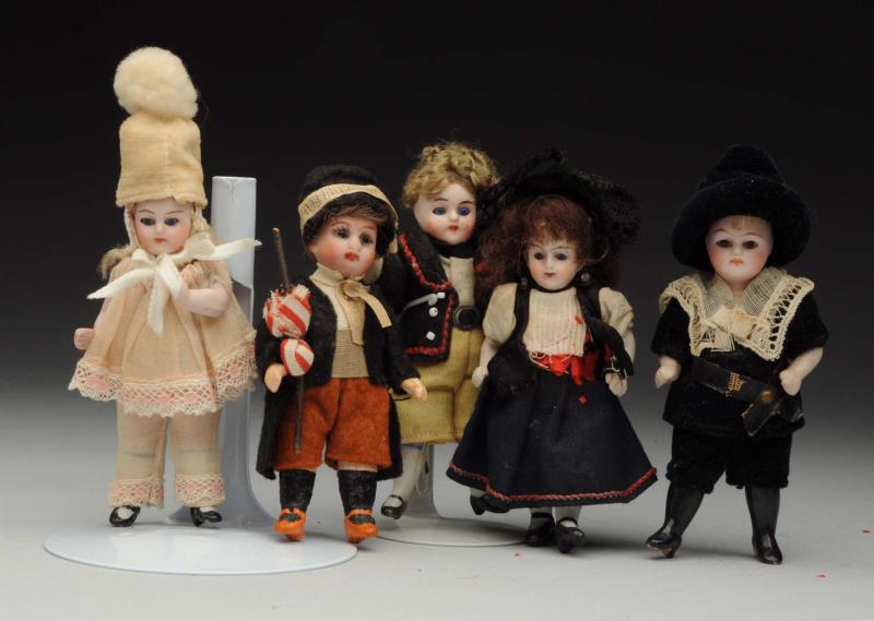 Appraisal: Lot Of German Dolls Boy with bisque head and five-piece