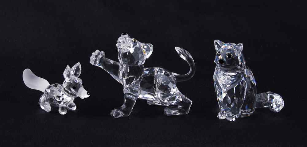 Appraisal: SWAROVSKI CRYSTAL FIGURINES To include LION CUB Adi Stocker designer