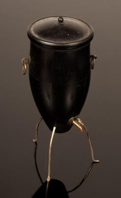 Appraisal: A late th Century French ebonised samovar etui on a