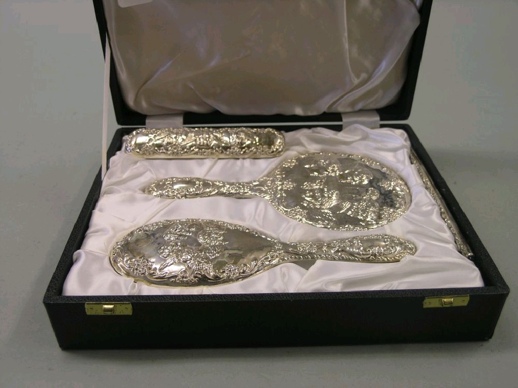 Appraisal: A silver dressing set consisting of hairbrush clothes brush comb