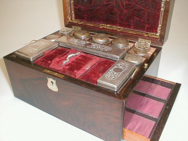 Appraisal: A Victorian rosewood dressing table box fitted with leather and