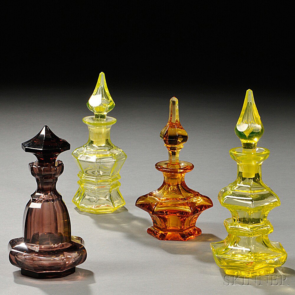 Appraisal: Four Pressed Glass Colognes probably th century Boston Sandwich Glass