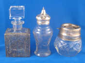 Appraisal: A silver topped glass caster ht cm Birmingham and a