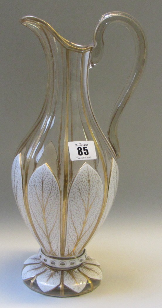 Appraisal: A glass ewer with white enamel overlay late th century