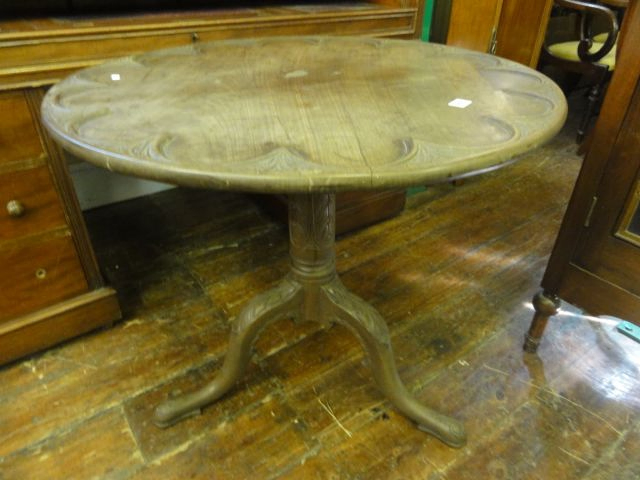 Appraisal: A Georgian mahogany supper table the circular top with carved