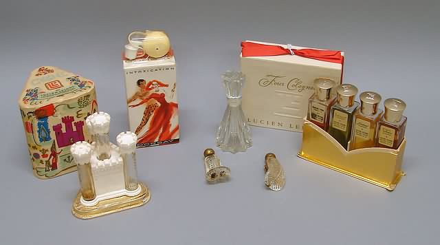 Appraisal: Lucien LeLong Castel and dress clip four colognes Intoxication by