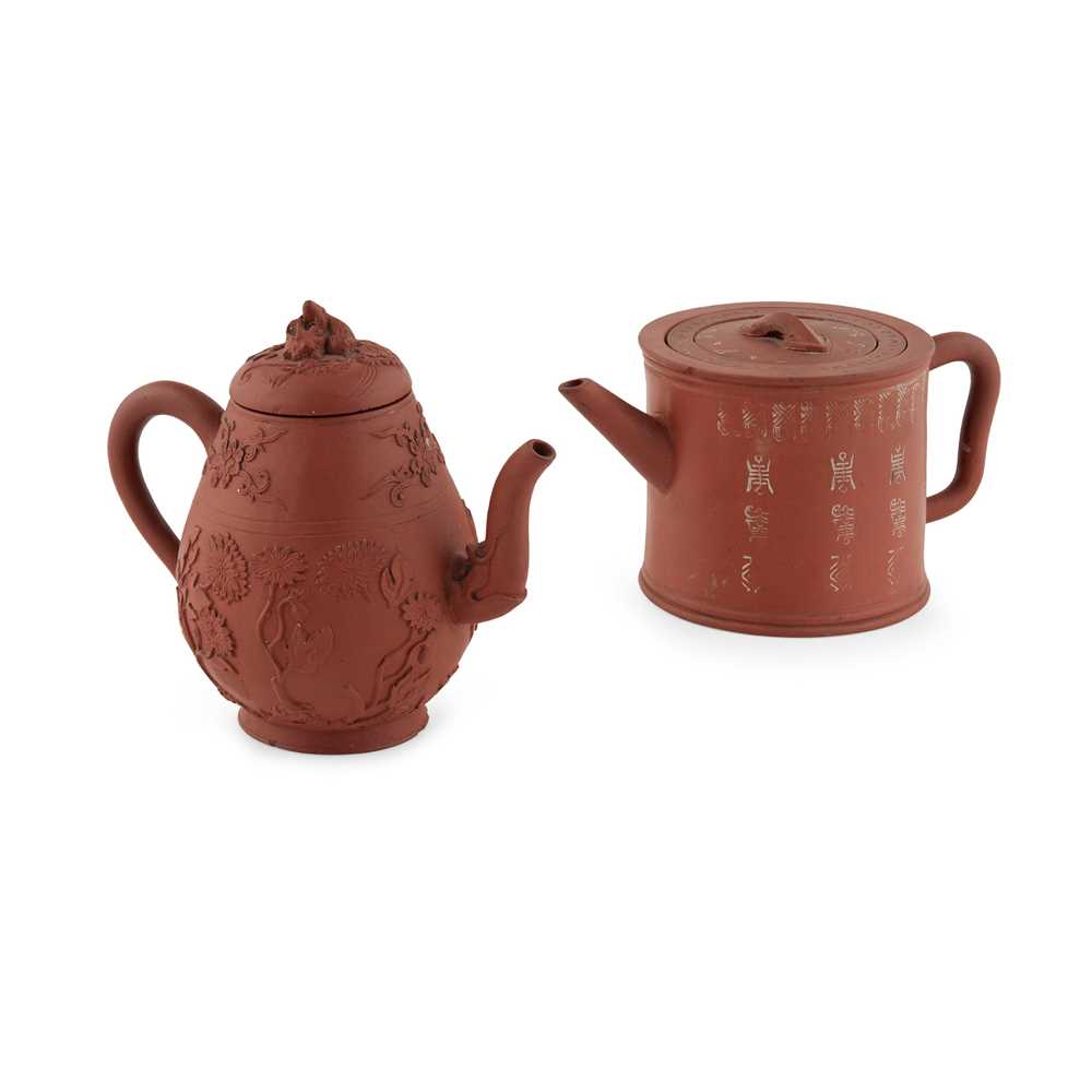 Appraisal: TWO YIXING STONEWARE TEAPOTS comprising a cylindrical form teapot decorated