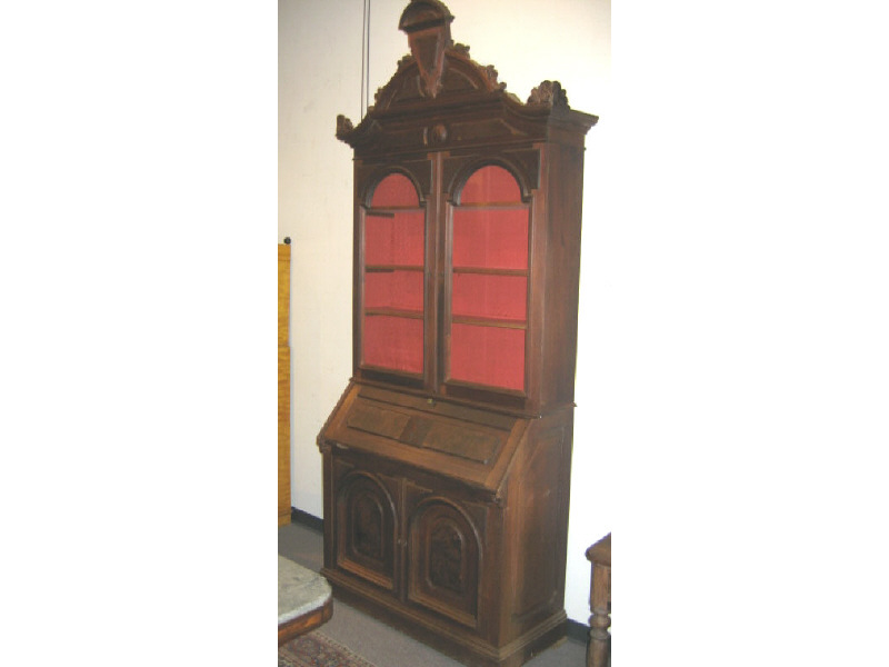 Appraisal: AMERICAN RENAISSANCE REVIVAL WALNUT TALL SECRETARY The arched crest highlighted