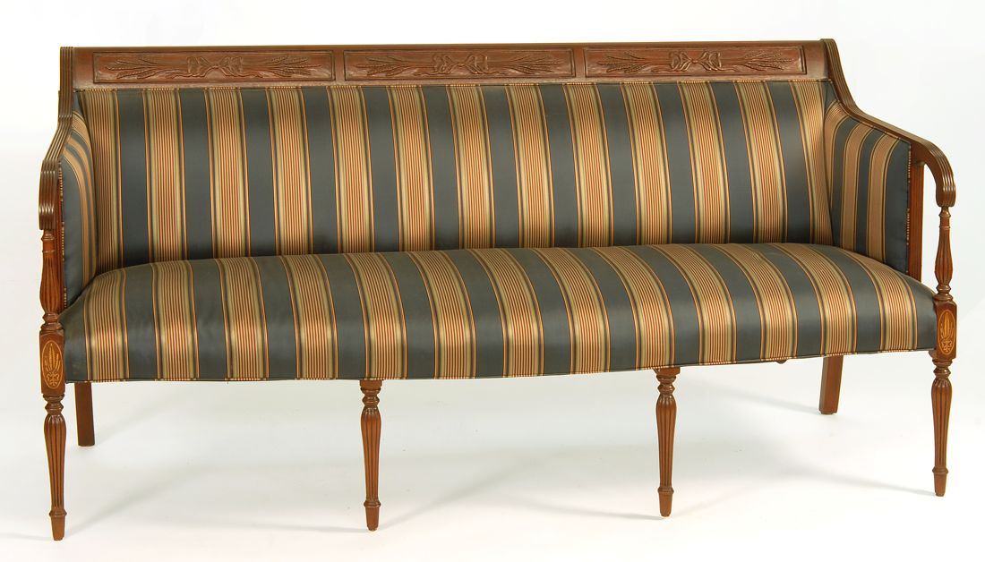 Appraisal: SHERATON-STYLE SOFA With wheat-carved three-panel back rail Four tapered reeded