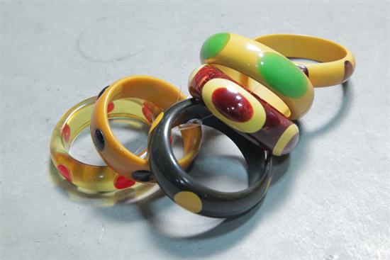 Appraisal: SIX BAKELITE BRACELETS All with inlaid dots Three yellow one