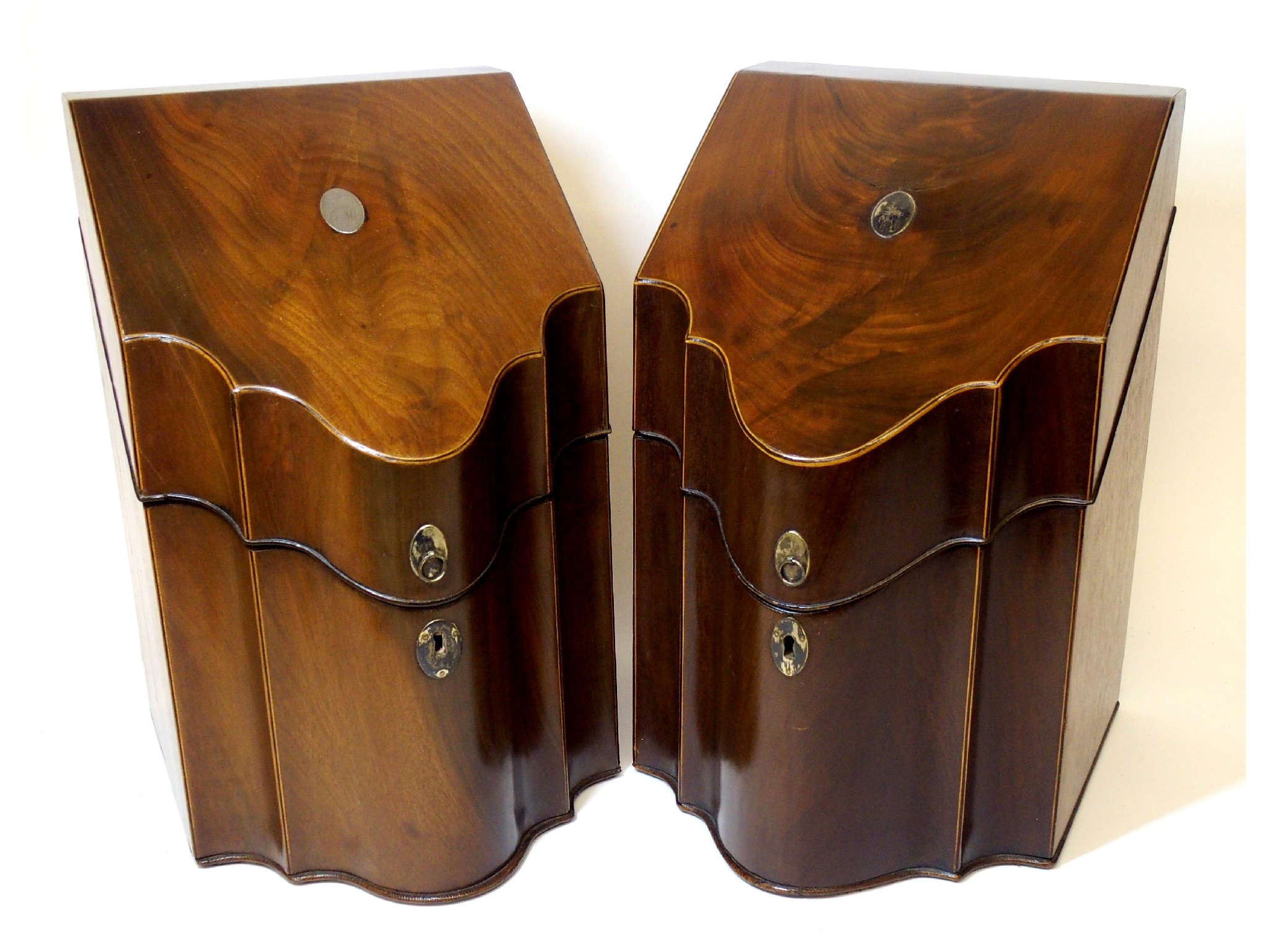 Appraisal: A pair of Georgian mahogany knife boxesthe shaped boxes with