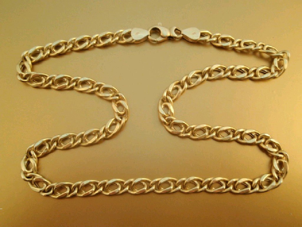 Appraisal: A yellow metal neck chain stamped