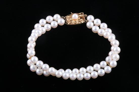 Appraisal: SIGNED MIKIMOTO DOUBLE-STRAND MATCHED CULTURED PEARL BRACELET K yellow gold