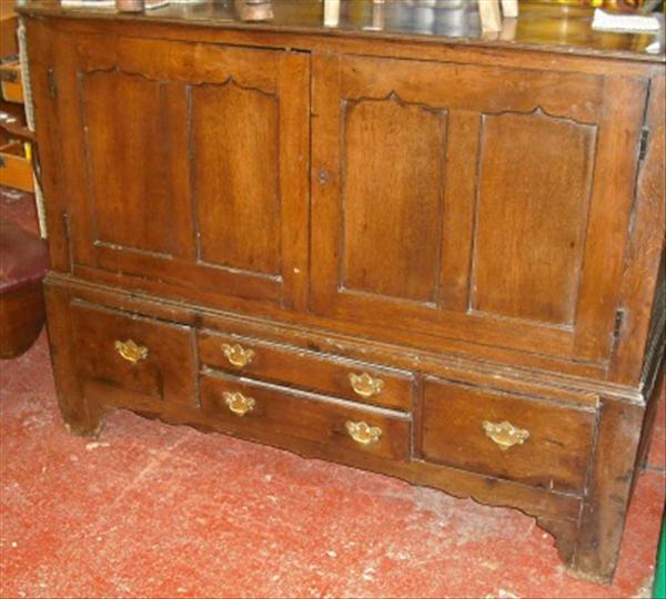 Appraisal: An oak mule chest fitted with four drawers