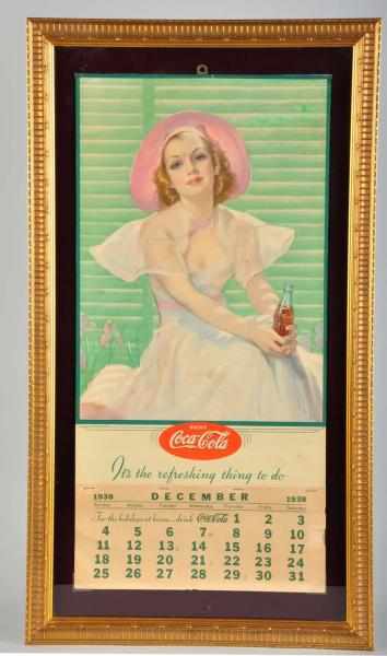 Appraisal: Coca-Cola Calendar Description Framed under glass With metal strip and