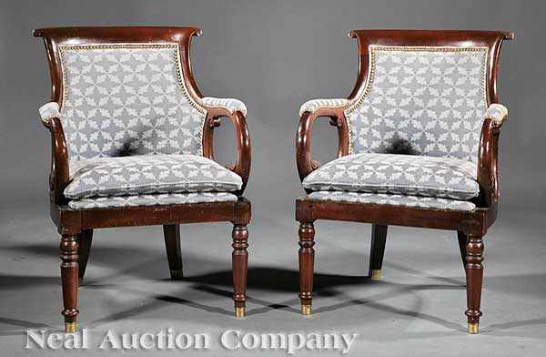 Appraisal: A Pair of Regency-Style Carved Mahogany Armchairs th c scrolled