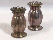 Appraisal: A pair of miniature silver vases hallmarked Birmingham