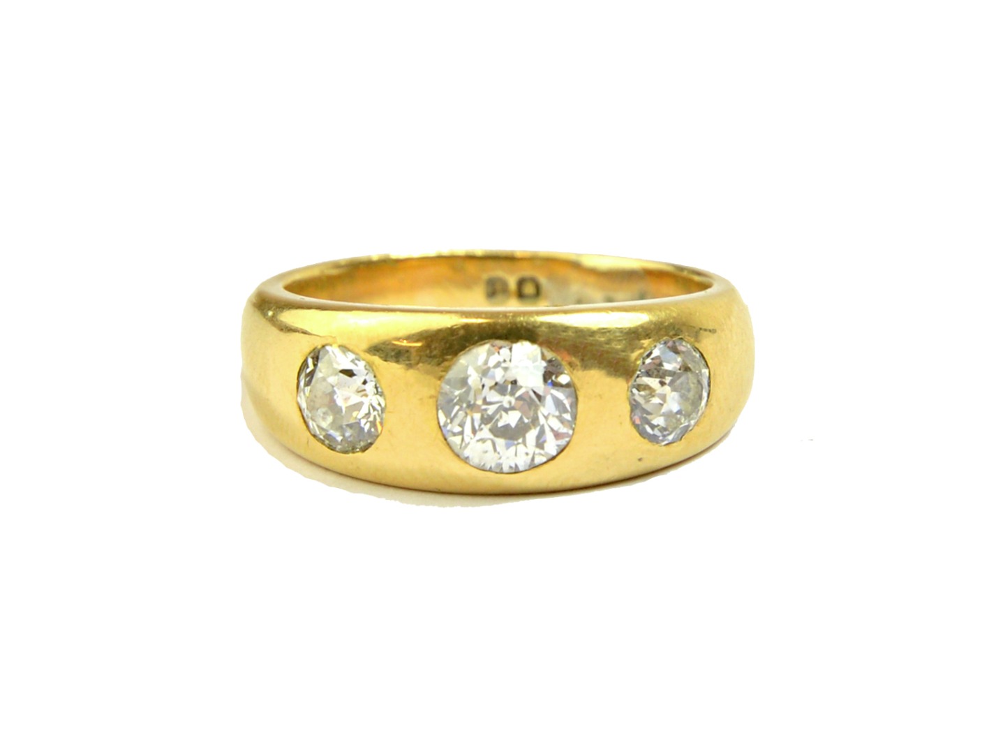 Appraisal: A gold and diamond set three stone ring gypsy set