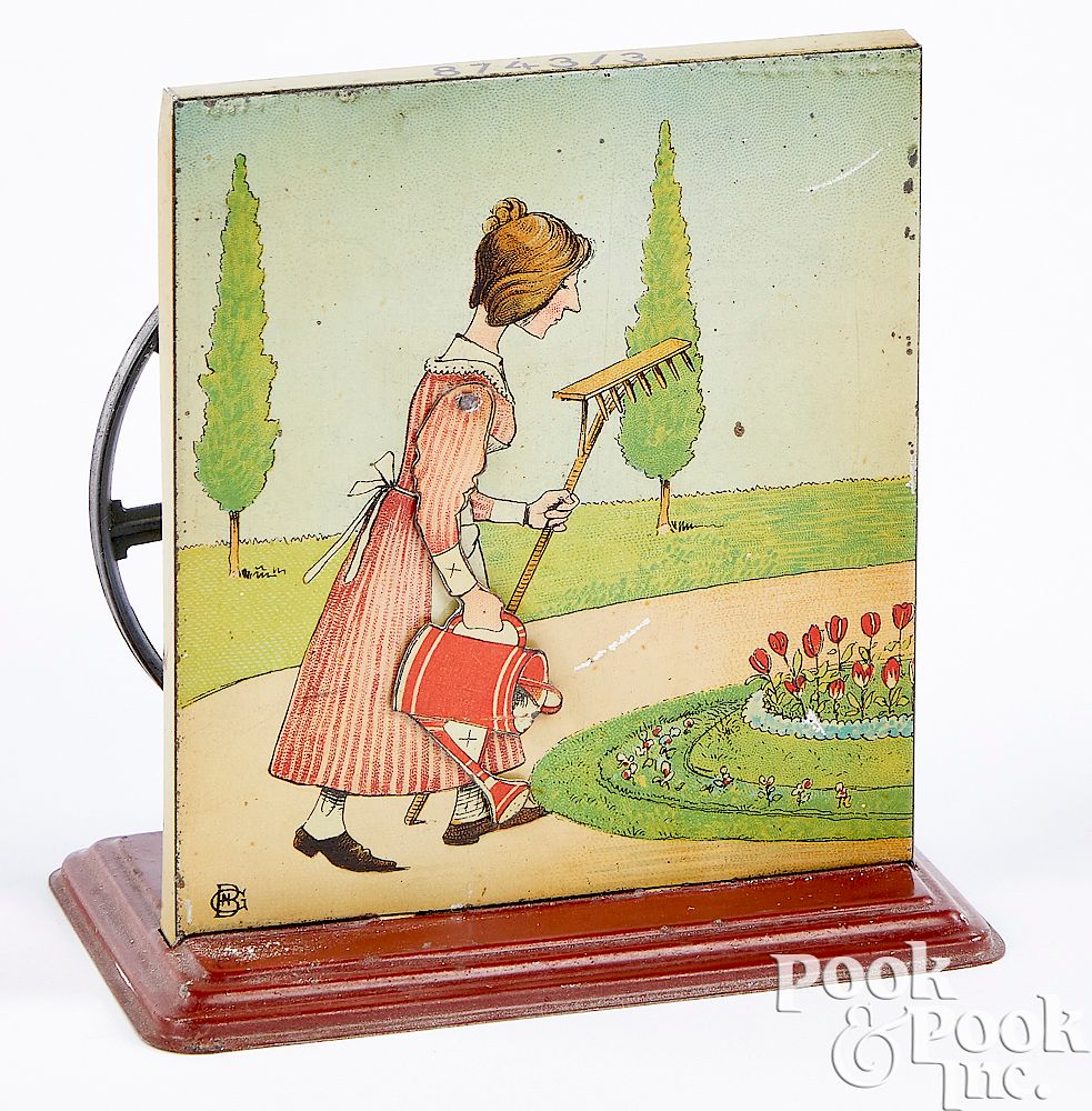 Appraisal: Bing woman watering flowers steam toy accessory Bing tin lithograph