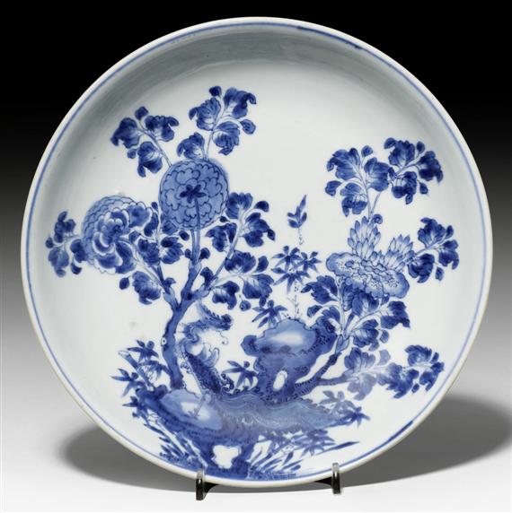 Appraisal: A BLUE AND WHITE SAUCER DECORATED WITH PEONIES AND A