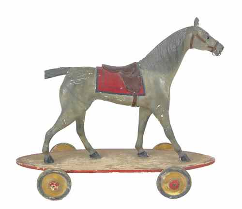 Appraisal: Carved and painted hackney horse pull toy ca h w