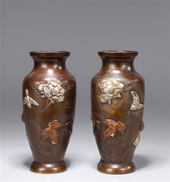 Appraisal: Pair of superb Japanese well cast mixed-metal sahkudo vases with