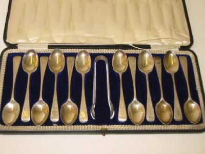 Appraisal: A COMPOSITE SET OF TWELVE TEASPOONS and a pair of