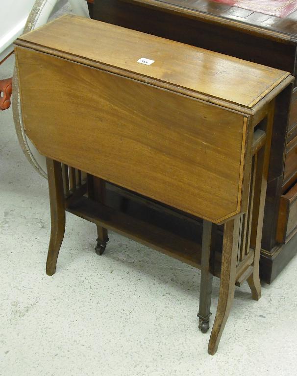 Appraisal: Edwardian mahogany Sutherland table with satinwood banding and supported upon