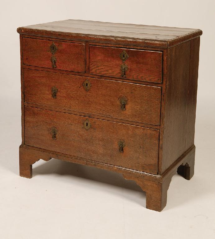 Appraisal: A GEORGE I OAK CHEST OF DRAWERS the rectangular top