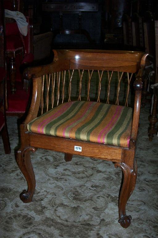 Appraisal: An unusual mid th century elbow chair with horseshoe shaped