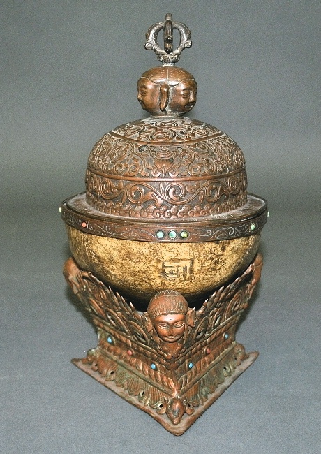 Appraisal: - Tibetan kapala th c with bronze cover and stand