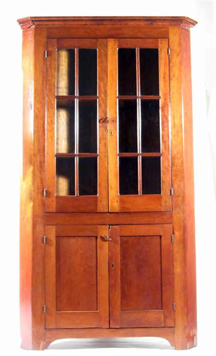 Appraisal: Cherry corner cupboard Molded cornice over two glazed doors opening