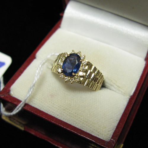 Appraisal: BLUE SAPPHIRE DIAMOND AND FOURTEEN KARAT GOLD RING The band