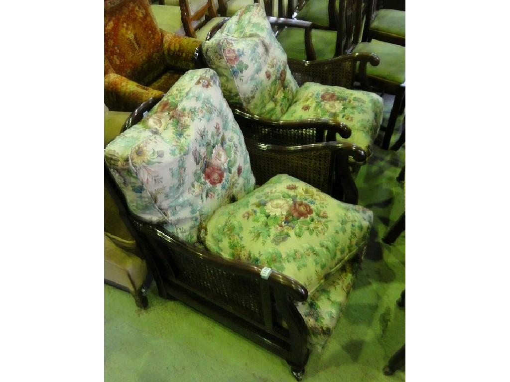 Appraisal: A pair of Edwardian bergere low seated armchairs with shaped