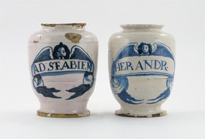 Appraisal: Two early delftware dry drug jars each lightly ribbed body