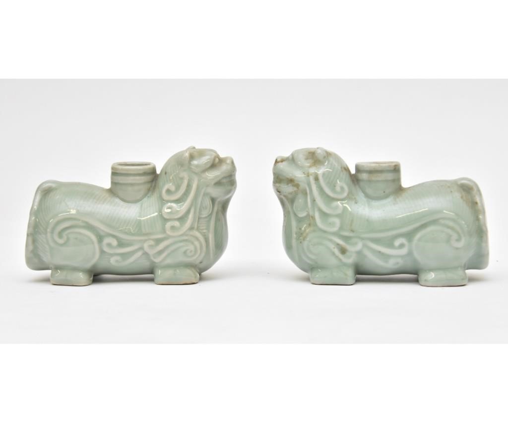 Appraisal: Pair of Chinese celadon dog form candlesticks th c h