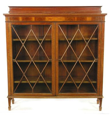 Appraisal: A mahogany cabinet with stringing and a pair of astragal