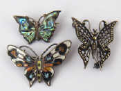 Appraisal: Three white metal tests silver butterfly brooches one enamelled and