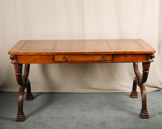 Appraisal: An English Regency-style Library Table with a tooled leather top