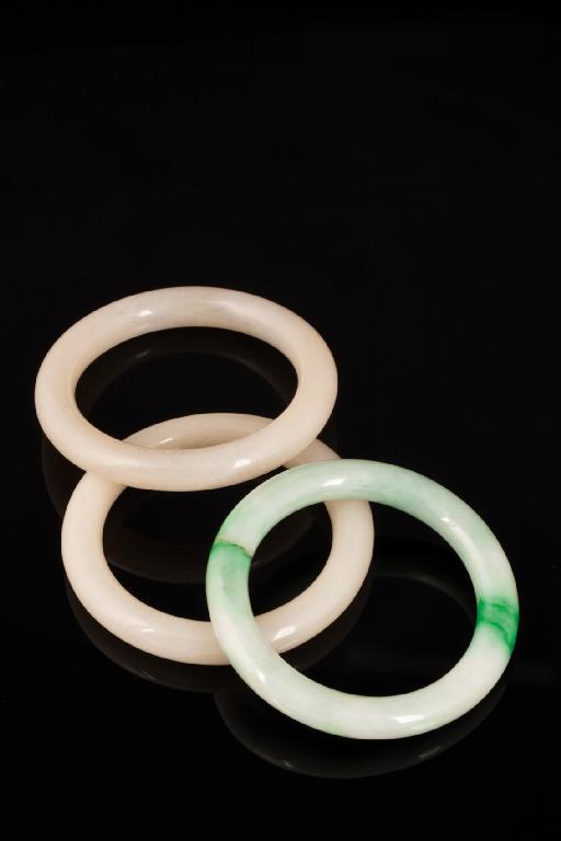 Appraisal: A PAIR OF CHINESE WHITE JADE BANGLES of plain form