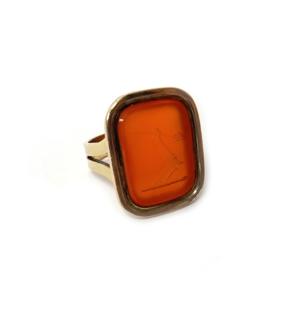 Appraisal: A gold and cornelian intaglio signet style ring crest seal