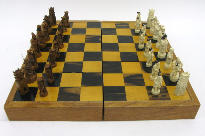 Appraisal: CHINESE CARVED IVORY CHESS SET AND BOARD pieces c 's