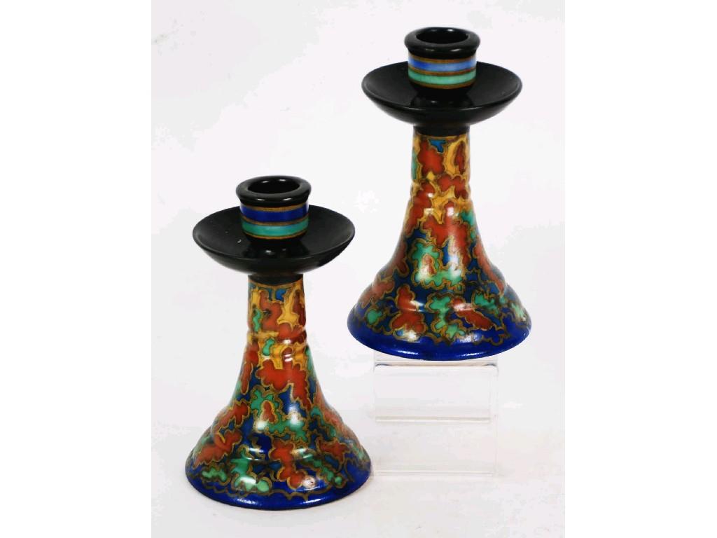 Appraisal: PAIR OF EARLY TWENTIETH CENTURY GOUDA POTTERY CANDLESTICK decorated in