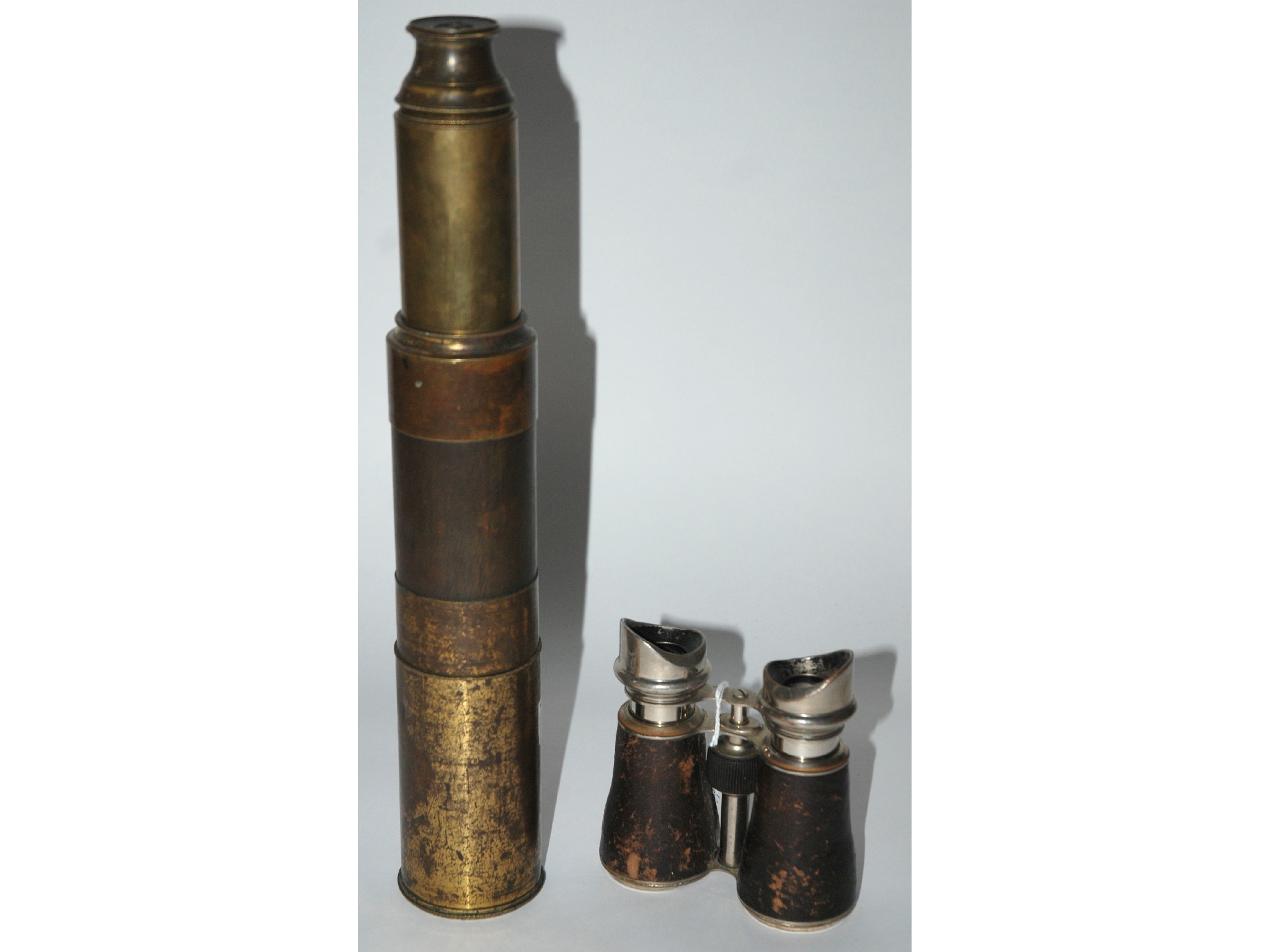 Appraisal: A brass three draw telescope and a pair of opera