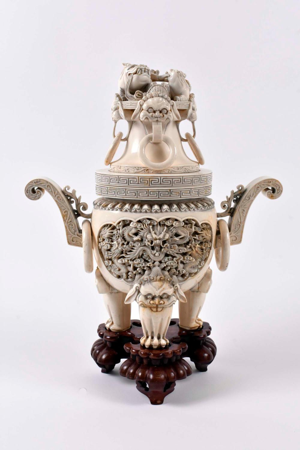 Appraisal: LARGE CHINESE ELABORATELY CARVED COVERED TRIPOD CENSORThe lid with lion